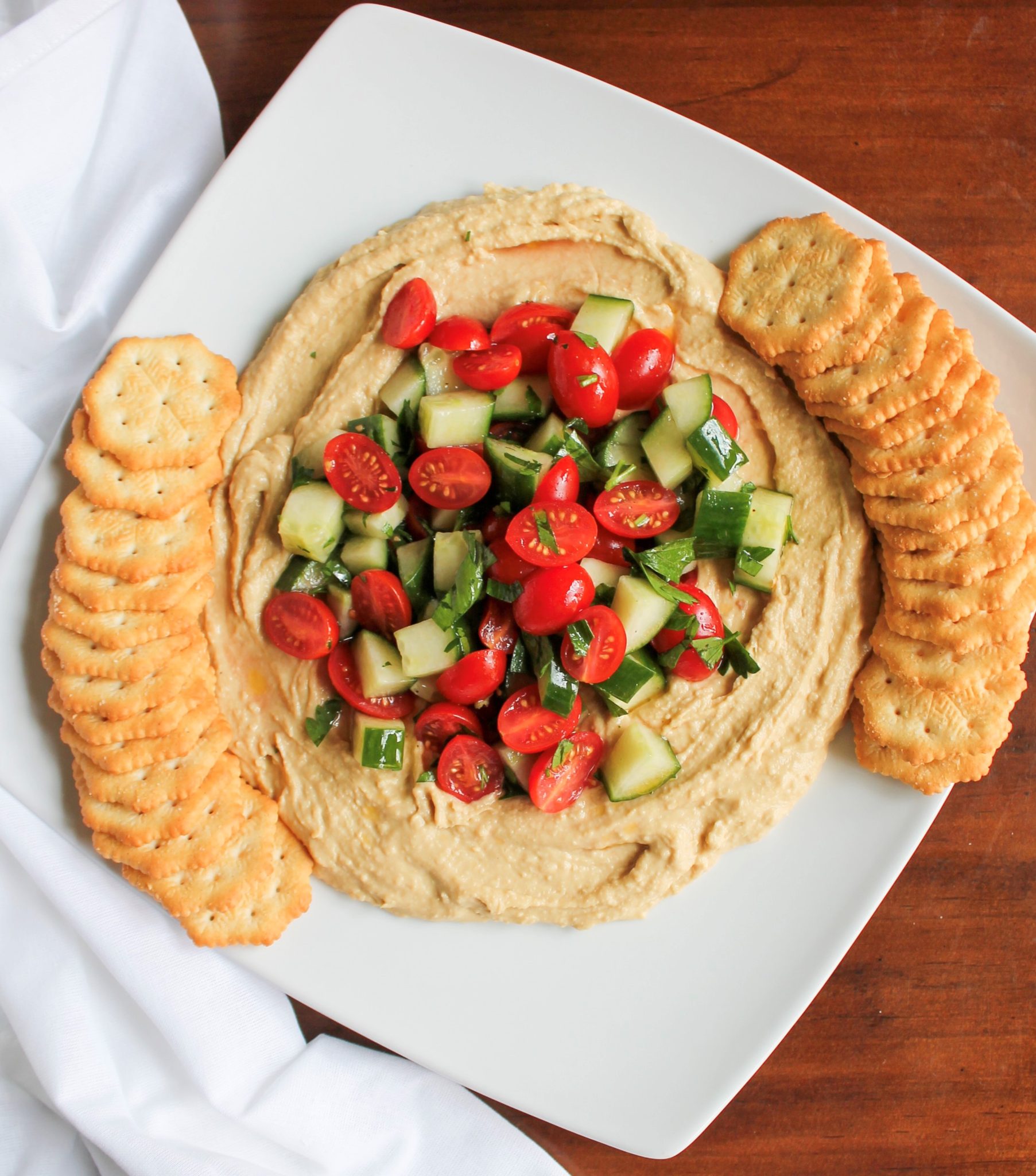 Quick and Easy Christmas Appetizer - Hummus Dip with Tomato and Cucumber Salad | sunshineandholly.com